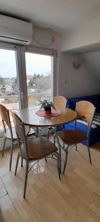 a dining room with a table and chairs at Airport Guesthouse Rooms and Apartmants in Beograd