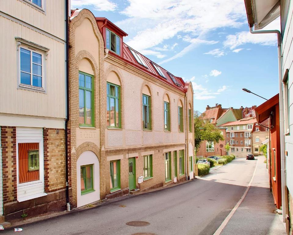 an empty street in a city with buildings at L Boutique Hotel in Lysekil