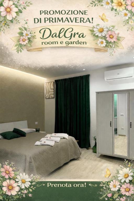 a bedroom with a bed and a sign with flowers on it at DalGra room e garden in Torrevecchia Teatina