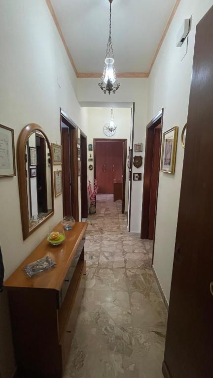 a hallway of a room with a counter and a mirror at Brezza Marina in Gallico