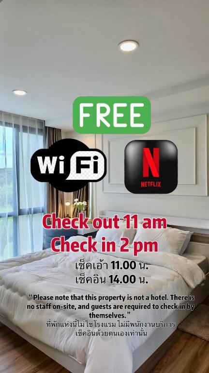 a advertisement for a wfc website with a bed in a bedroom at i-CONDO B2072 in Ban Liap