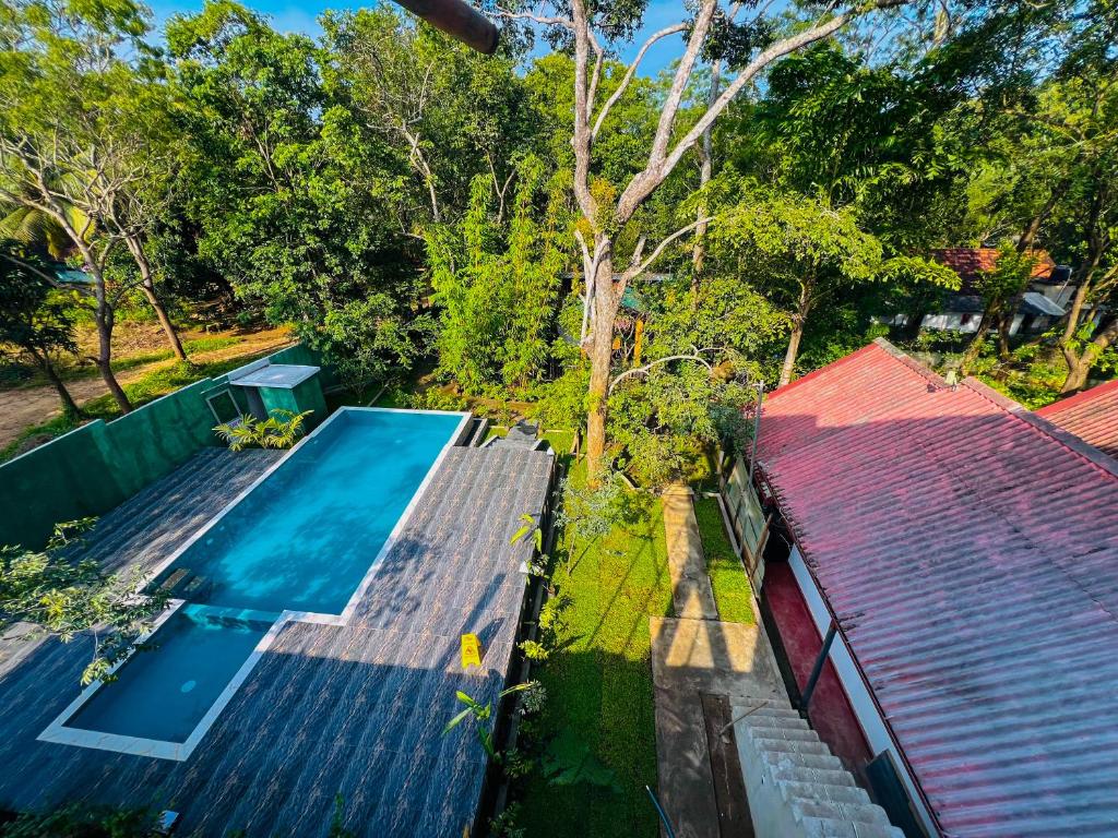 an overhead view of a swimming pool on top of a house at Victory Villa Sigiriya in Sigiriya