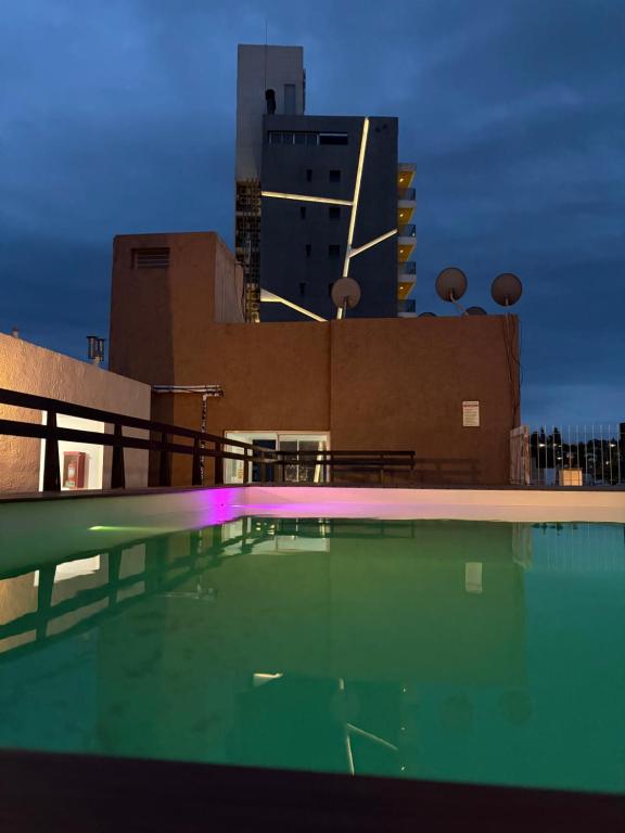 a swimming pool on top of a building at Amelia 2-1 in Villa Carlos Paz