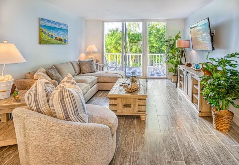 a living room with a couch and a table at Lighthouse Point 222 in Sanibel