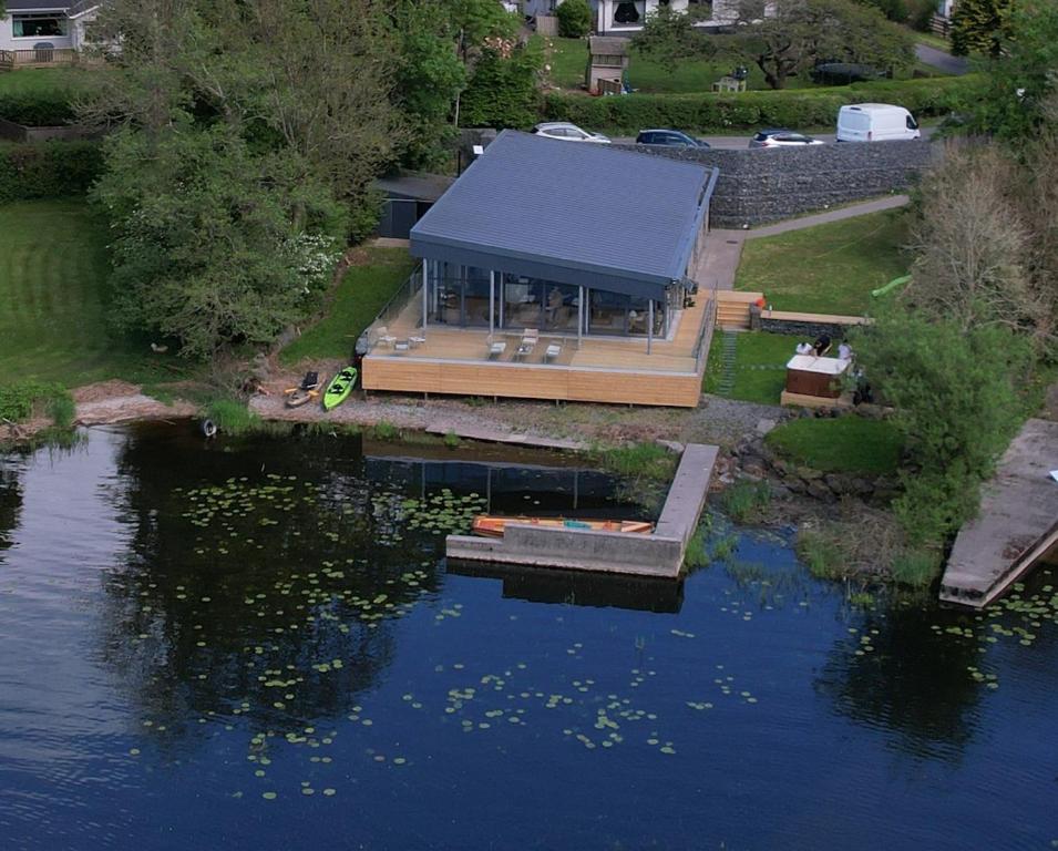 an aerial view of a house next to a lake at Sheelin Lake House in Cavan