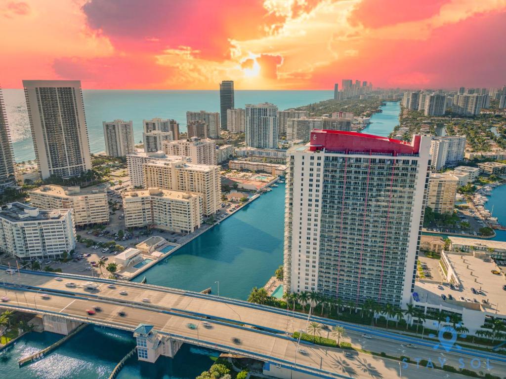 an aerial view of a city with a bridge at Beachwalk Condo in Hallandale Beach