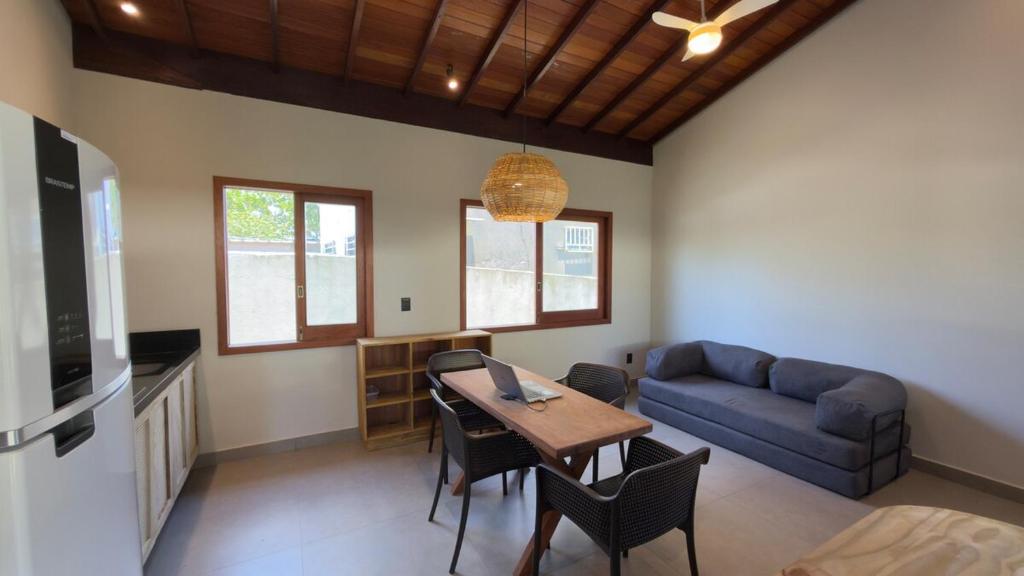 a living room with a table and a couch at Villa 4 Elements, Studios Praia de Saquaíra, Maraú in Marau