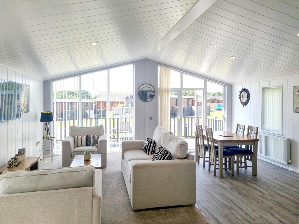 a living room with two couches and a table at Cherry Blossom 40 - Uk50709 in Garton