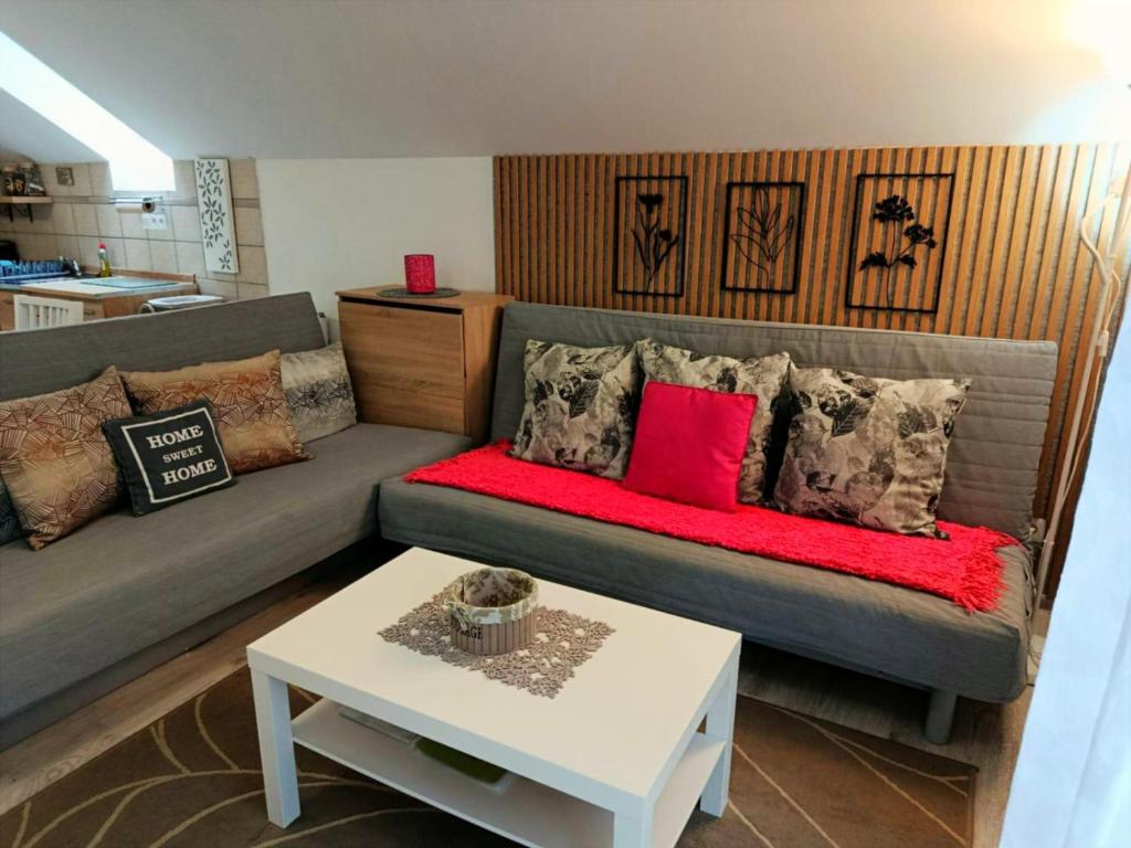 a living room with a couch and a table at Apartmán Romanna in Terchová