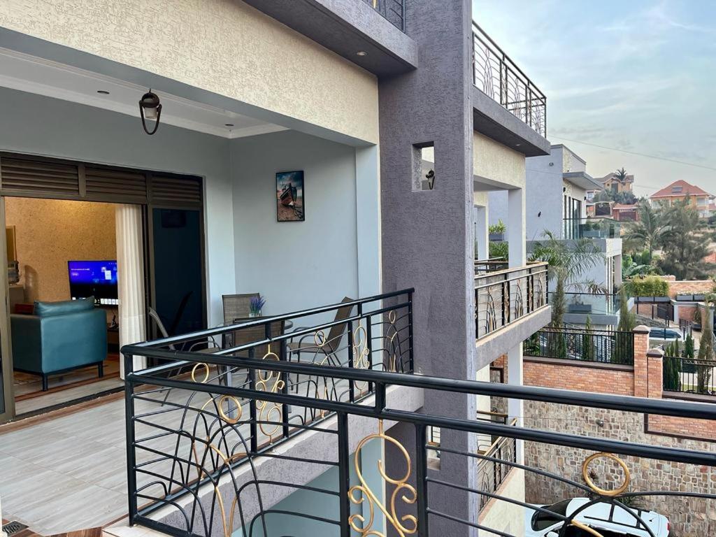 a balcony with a view of a living room at Quiet Home Apartment in Kigali