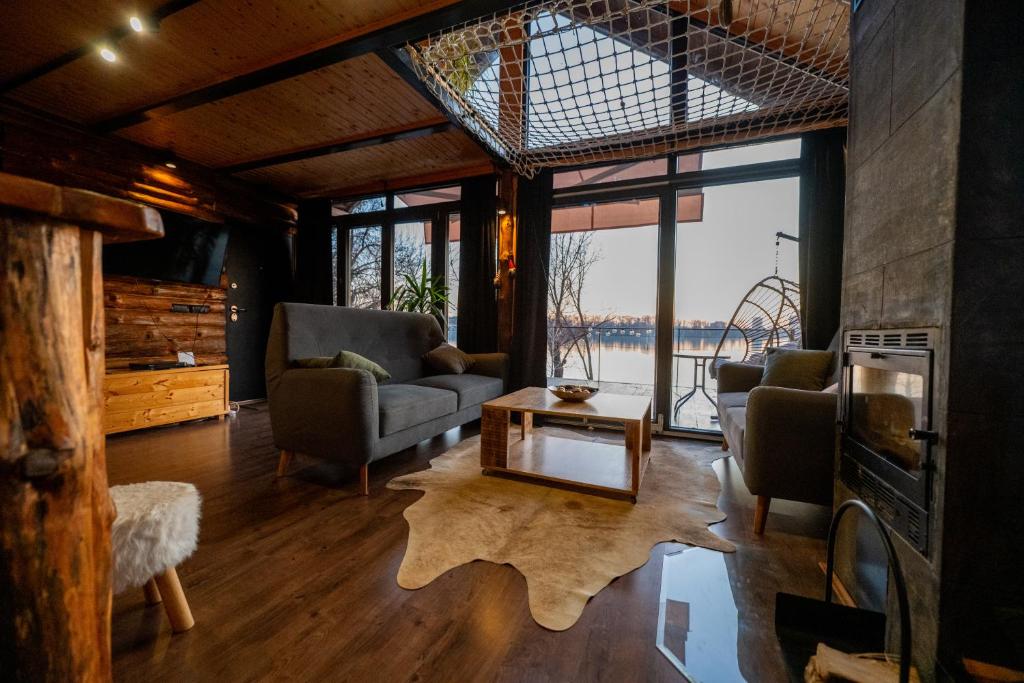 a living room with a view of the water at Danube Retreat in Belgrade