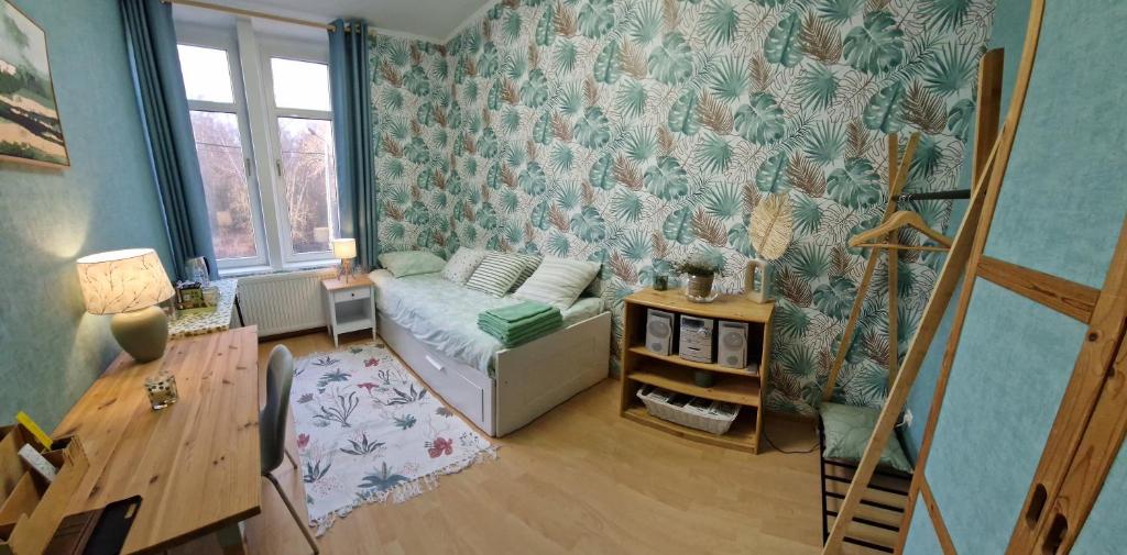 a living room with a couch and a table at Le Nichoir de la Biesme in Aiseau