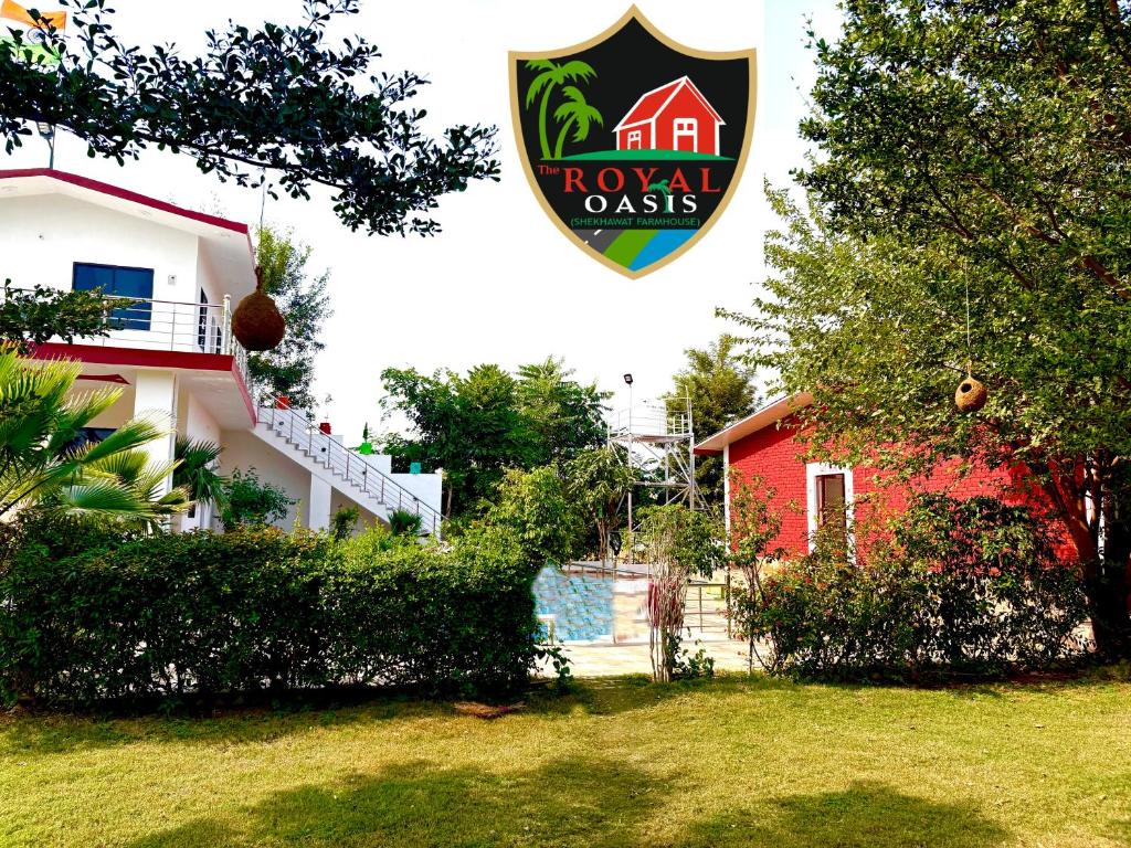 a house with a sign that reads royal oak at The ROYAL OASIS in Khetri