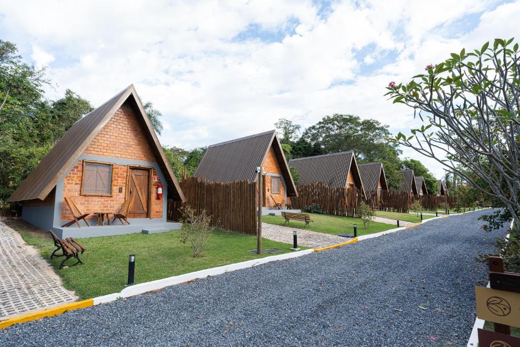 a row of cottages on the side of a road at Tekoha Eco Hotel in Bonito