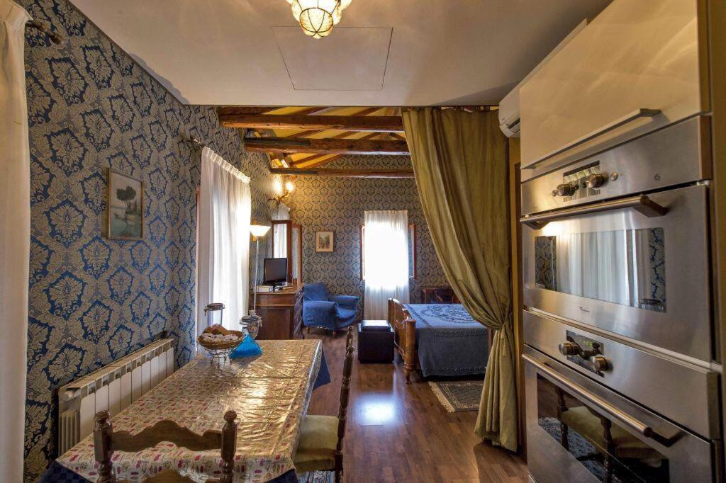 a living room with a couch and a table in a room at Cà Fede in Venice