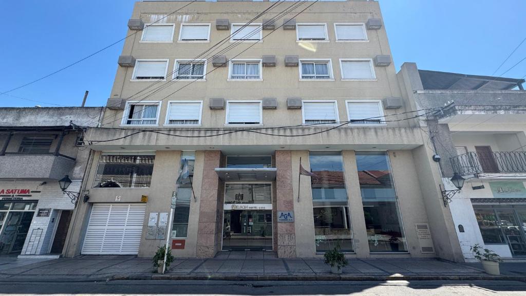 a tall building with windows on a city street at Wilson Hotel in Salta