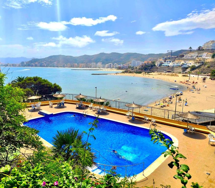 a view of a beach with a large swimming pool at Isla de los Pensamientos in Faro de Cullera