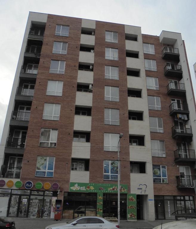 an apartment building on the corner of a street at apartament in Tbilisi City