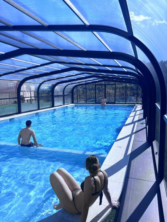 a group of people in a swimming pool at Casa Rural Puente del S,egura in Elche de la Sierra