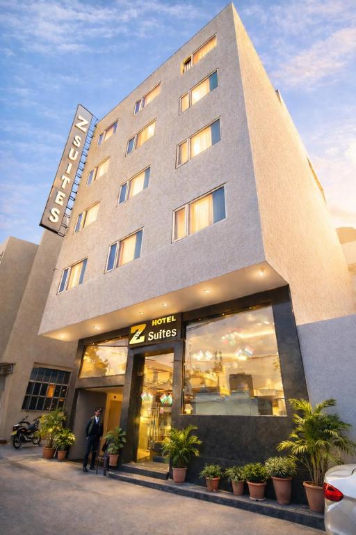 a man standing in front of a hotel at Hotel Z Suites Delhi Airport Mahipalpur- FREE Airport Pickup & Drop in New Delhi