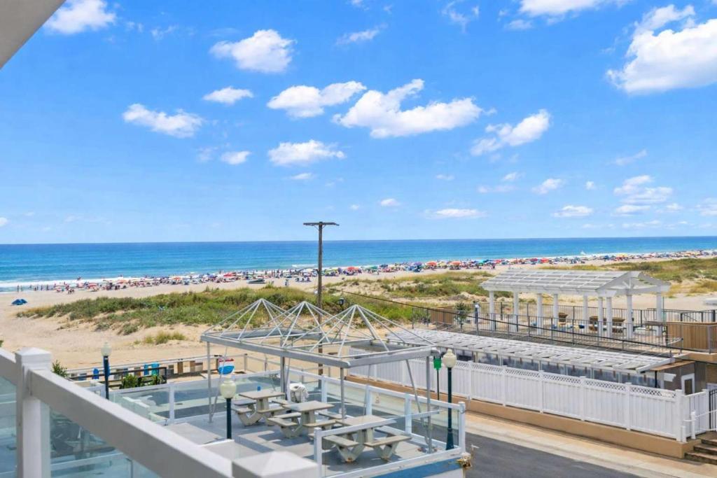 a view of the beach from the balcony of a condo at Beachfront WW Crest Condo Sleeps 6 in Wildwood Crest