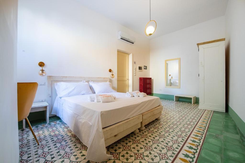 a bedroom with a large bed in a room at Moro Guest House in Lecce