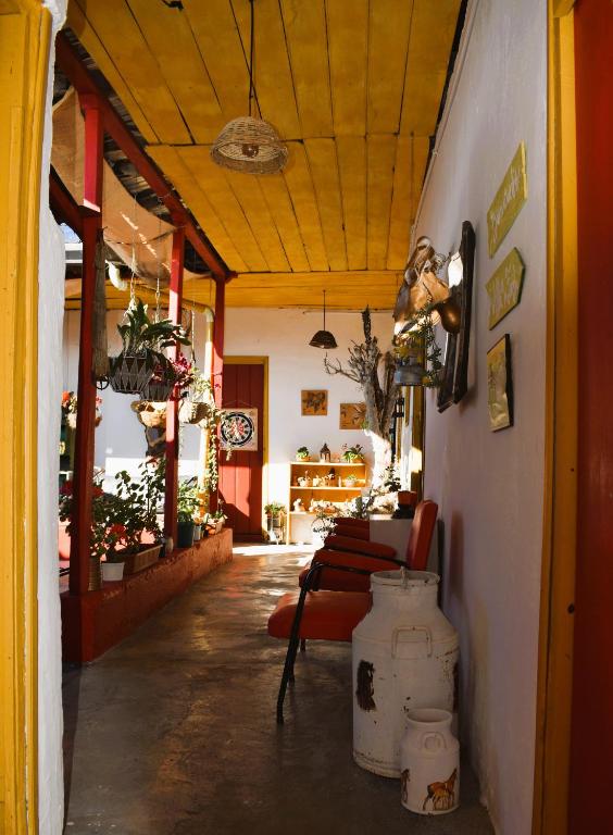 a room with a table and a chair in a building at El Hostal del Abuelo in Murillo