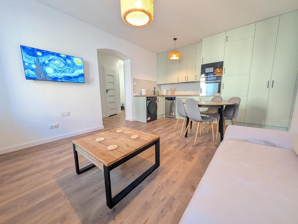 a living room with a couch and a table at Apartament Podgórze Wałbrzych in Wałbrzych