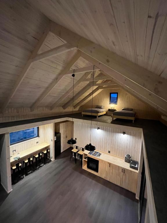 an overhead view of a kitchen and dining room in a house at Refuge with Panoramic Views, Cerro Castillo in Villa Cerro Castillo