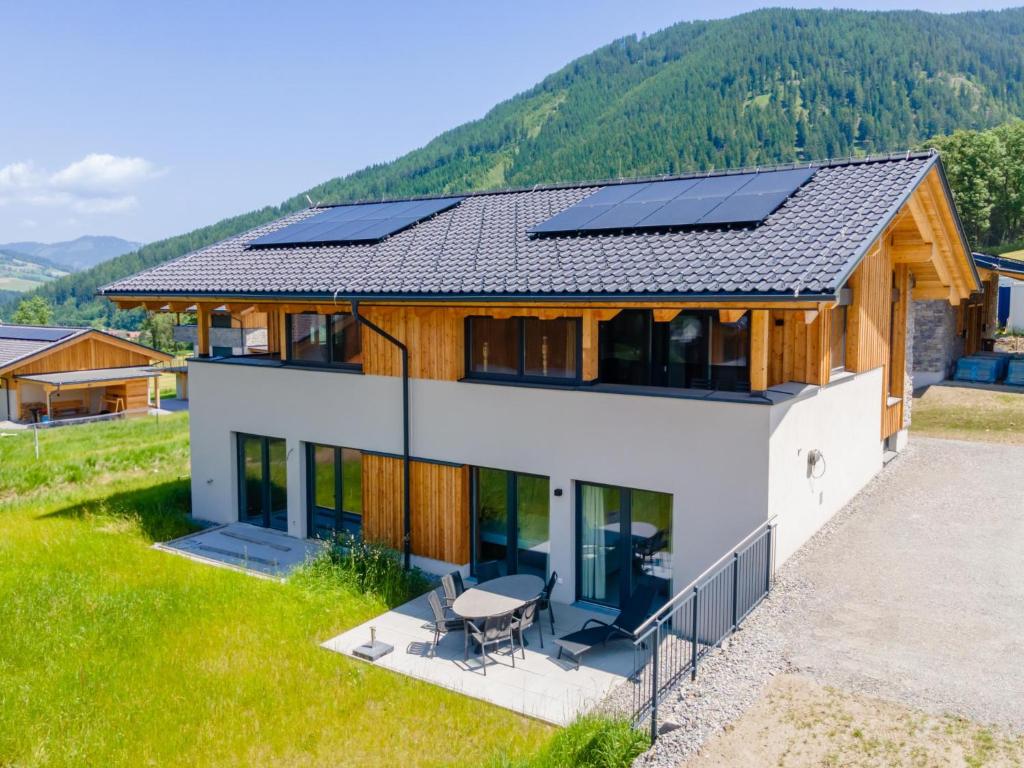 a house with solar panels on the roof at Grebenzen Lodges 49B in Sankt Lambrecht