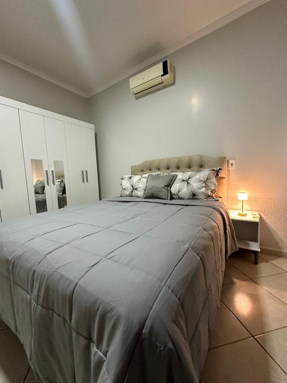 a bedroom with a large bed in a room at maray house complete elegance very well located in Formosa