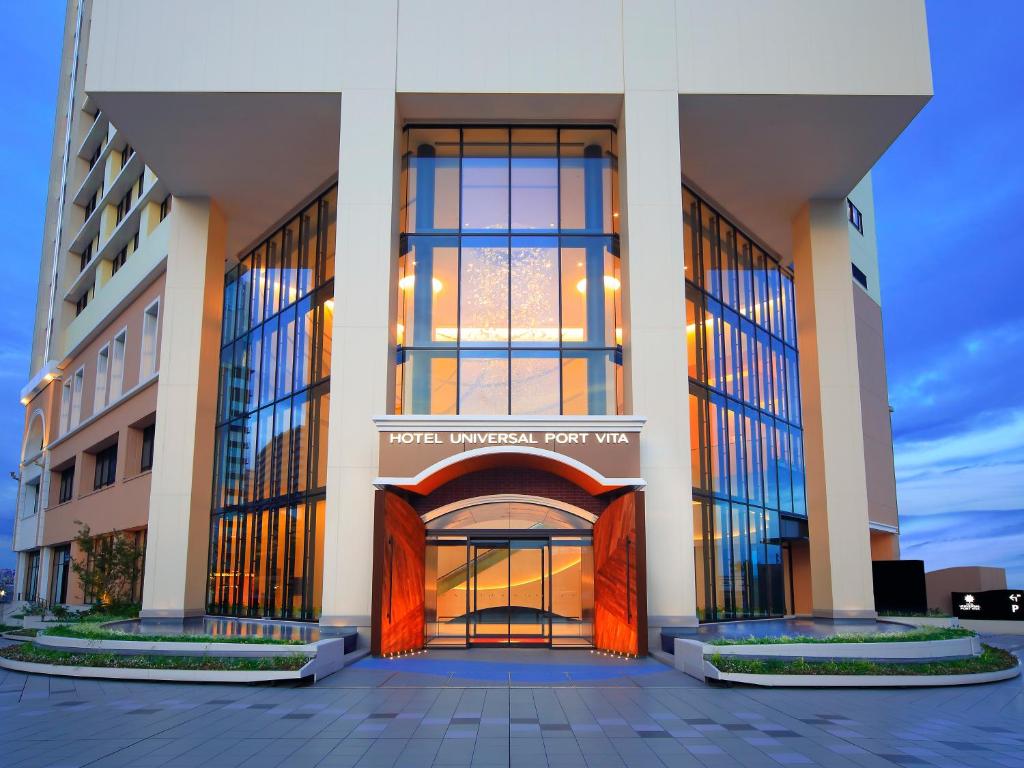 a building with an entrance to a hotel with a door at Hotel Universal Port Vita in Osaka