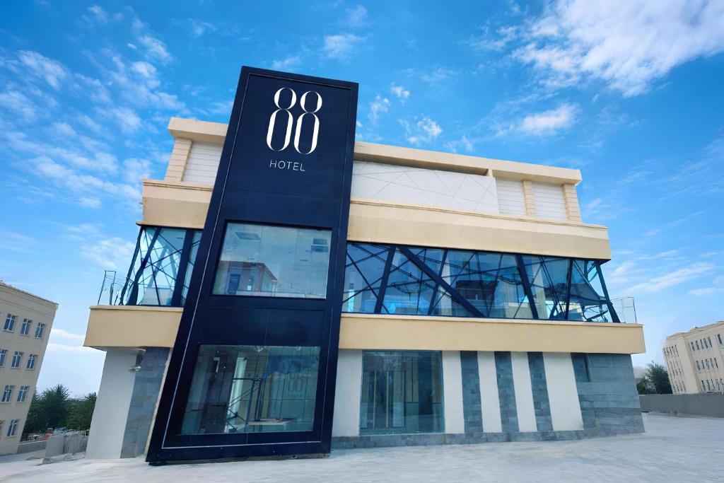 a building with a sign for the olympics at Hotel 88 Batulicin by WH in Batulicin