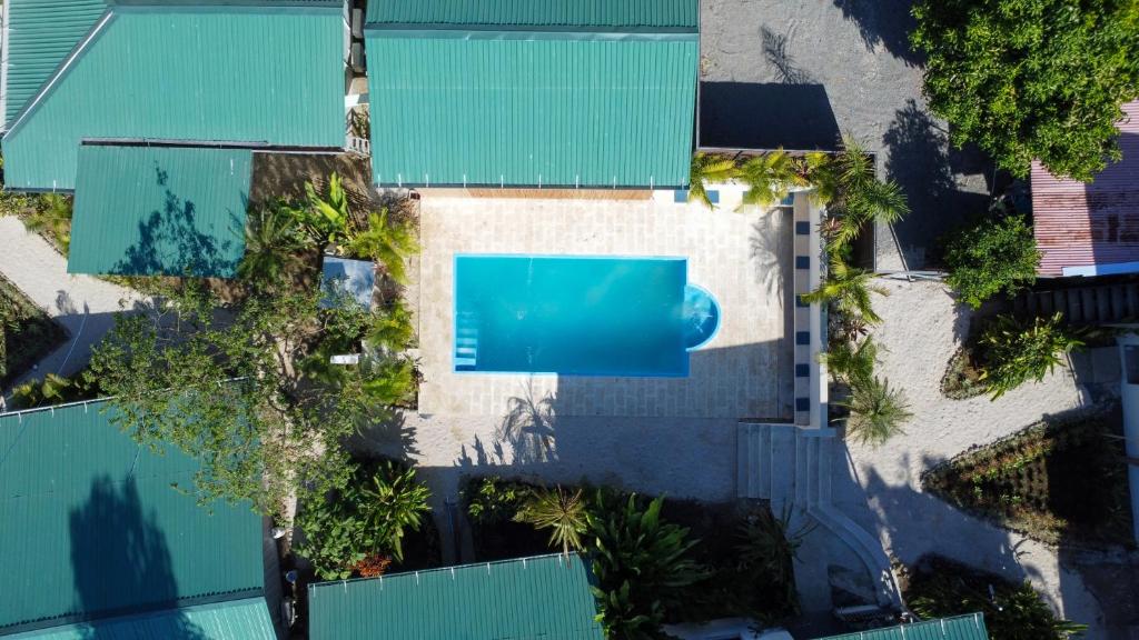an overhead view of a house with a swimming pool at KAIA VILLAGE, Santa Teresa, Costa Rica in Santa Teresa Beach