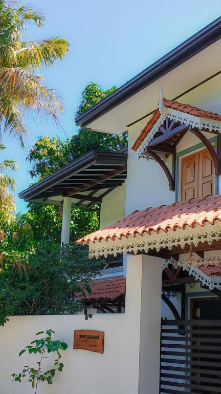 a house with a sign on the side of it at The White Crane Koggala in Habaraduwa Central