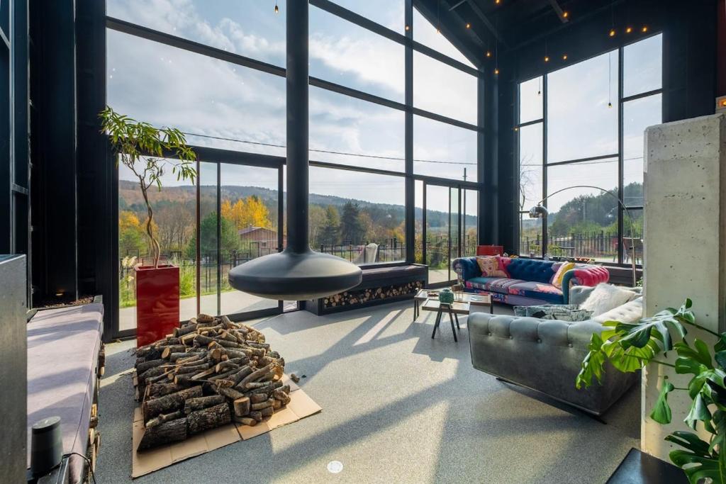 a living room with a couch and a fireplace at Villa Baraka in İznik