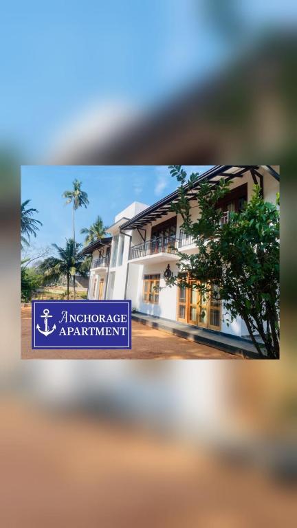 a sign in front of a building at Anchorage Apartment in Kurunegala