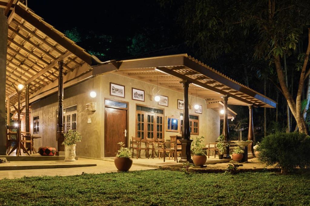 a house with a patio at night at Muthu Hiriketiya in Dickwella