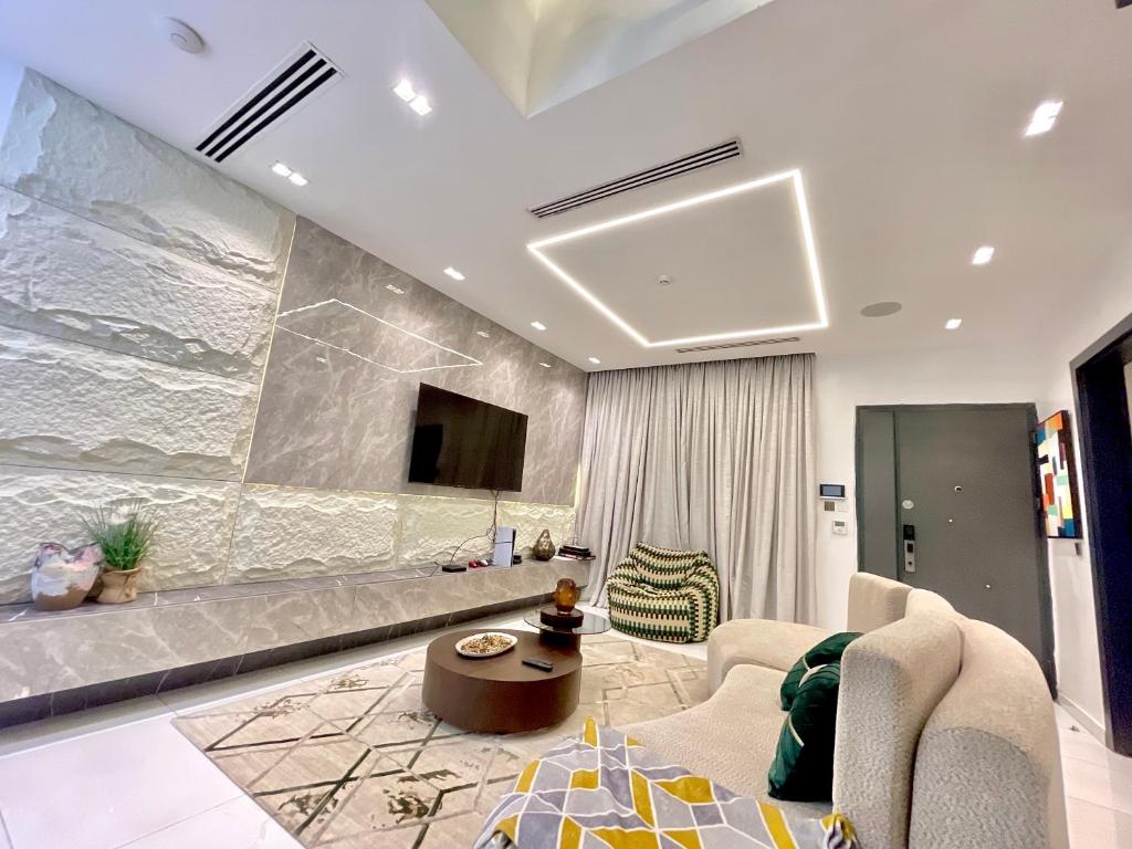 a living room with a couch and a tv at 2 Bedroom in Lekki phase 1 in Mama