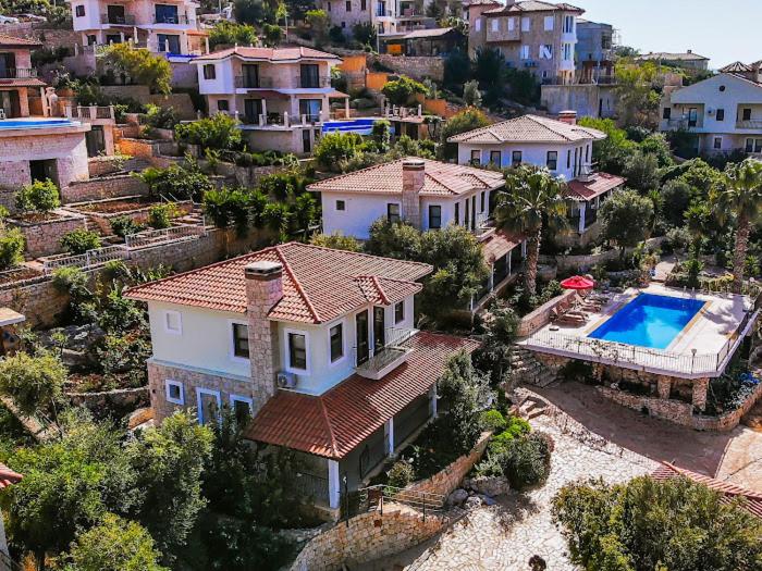 an aerial view of a house with a swimming pool at Villa Sarpedon in Kaş