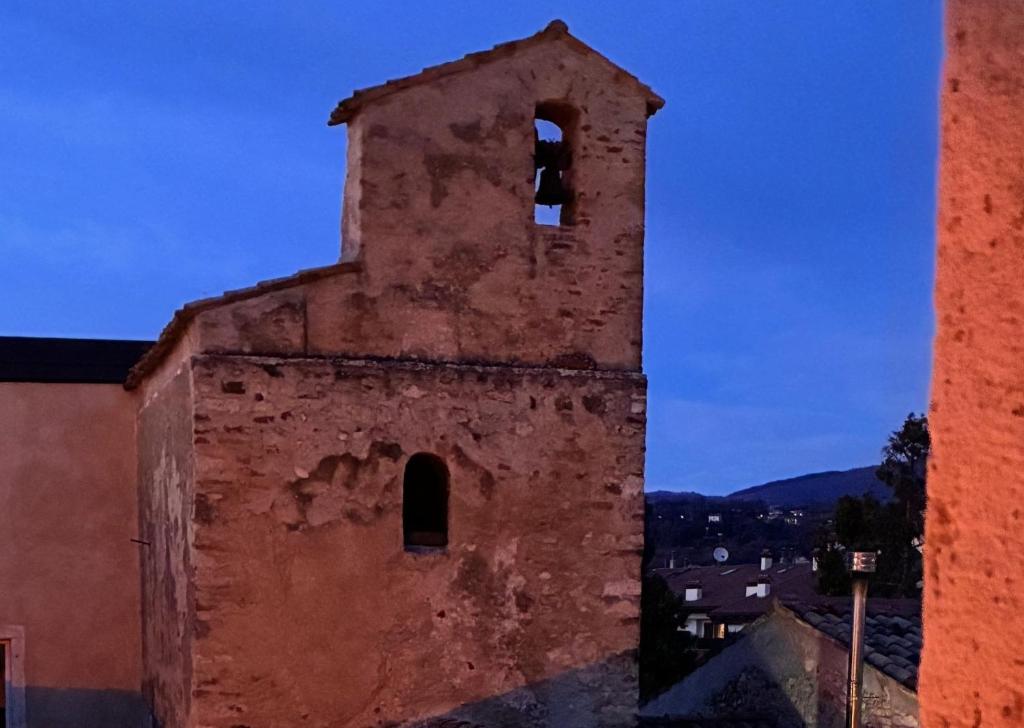 an old brick building with a tower with a window at Antico Borgo San Zeno in Bardolino