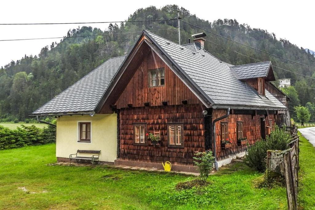 a small wooden house in the middle of a field at Haus Pfatschbacher in Wildalpen