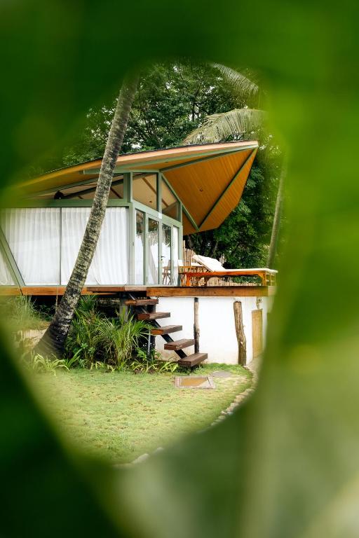 a house with a boat on top of it at Kama Haven in Semaya