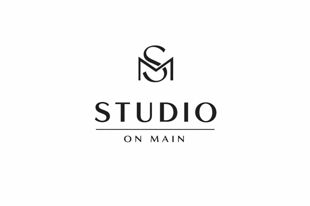 a logo for a studio on main at Studio on Main in Langebaan
