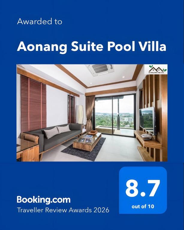 a living room with a couch and a tv at Aonang Suite Pool Villa in Ao Nang Beach