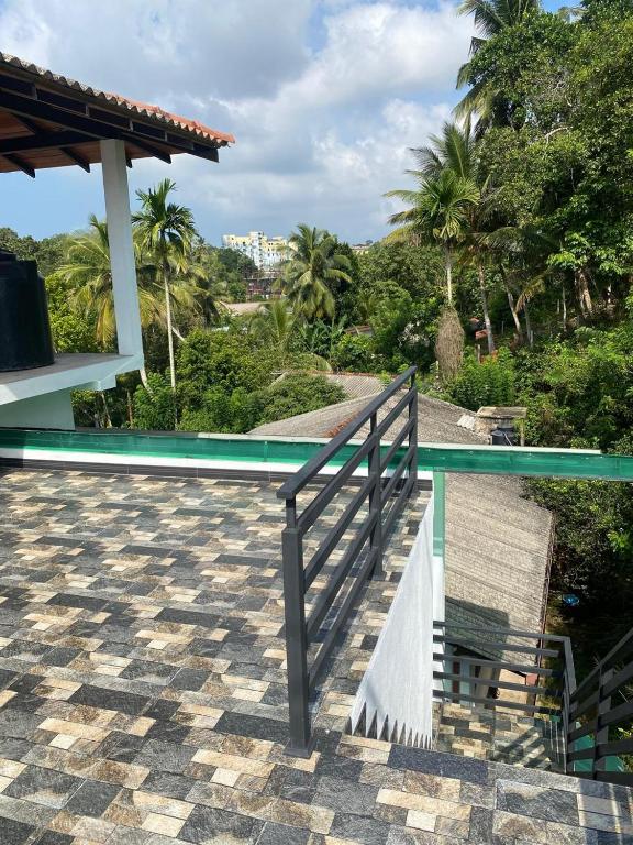 a stairway leading to a swimming pool on a house at Chandani Hostel in Galle