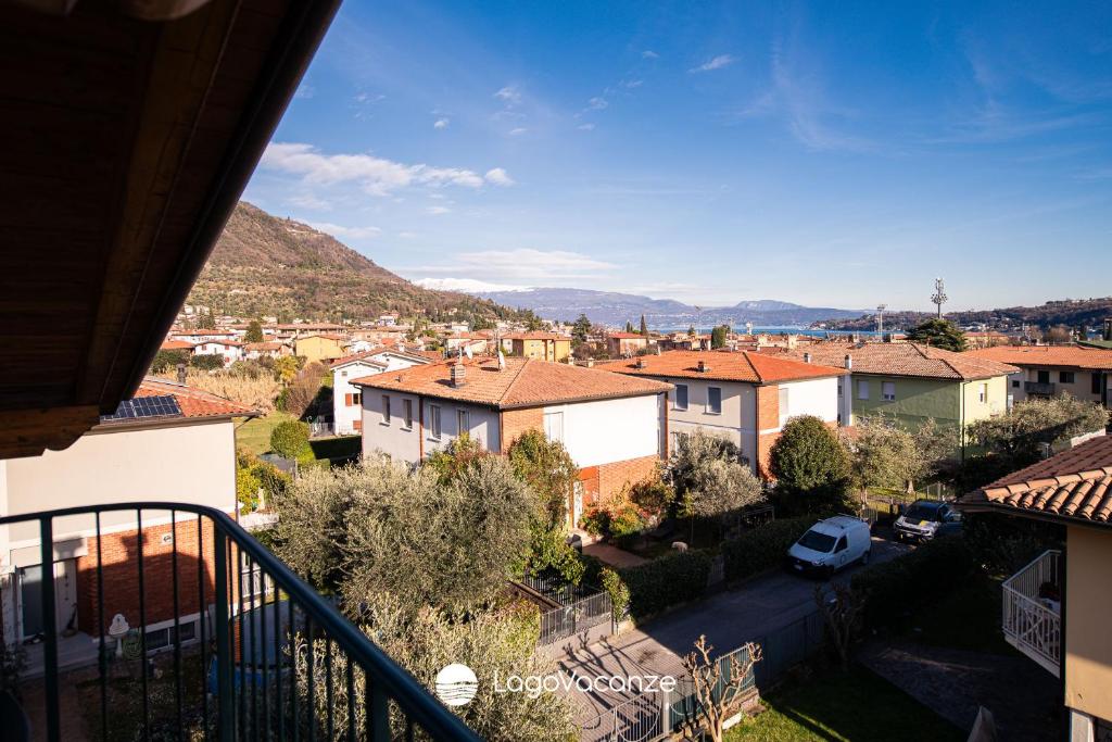 a view of a city from the balcony of a house at Appartamento Diana in Salò