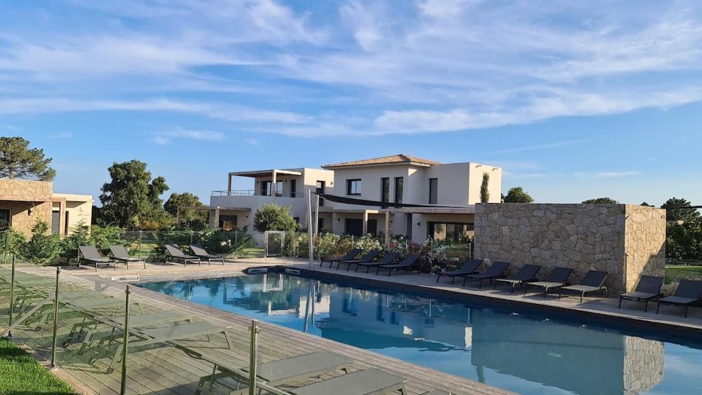 a view of a villa with a swimming pool at Villa U Picculu in Lecci