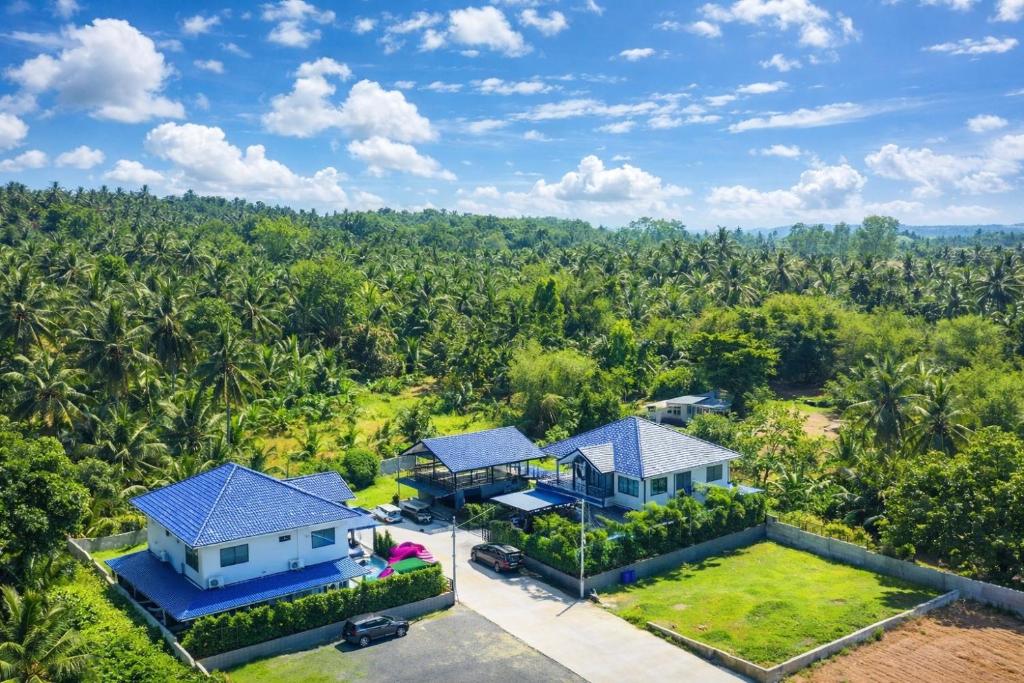 an aerial view of a house with a lot of trees at BanIngKhao Pool Villa Sriracha in Ban Hup Bon