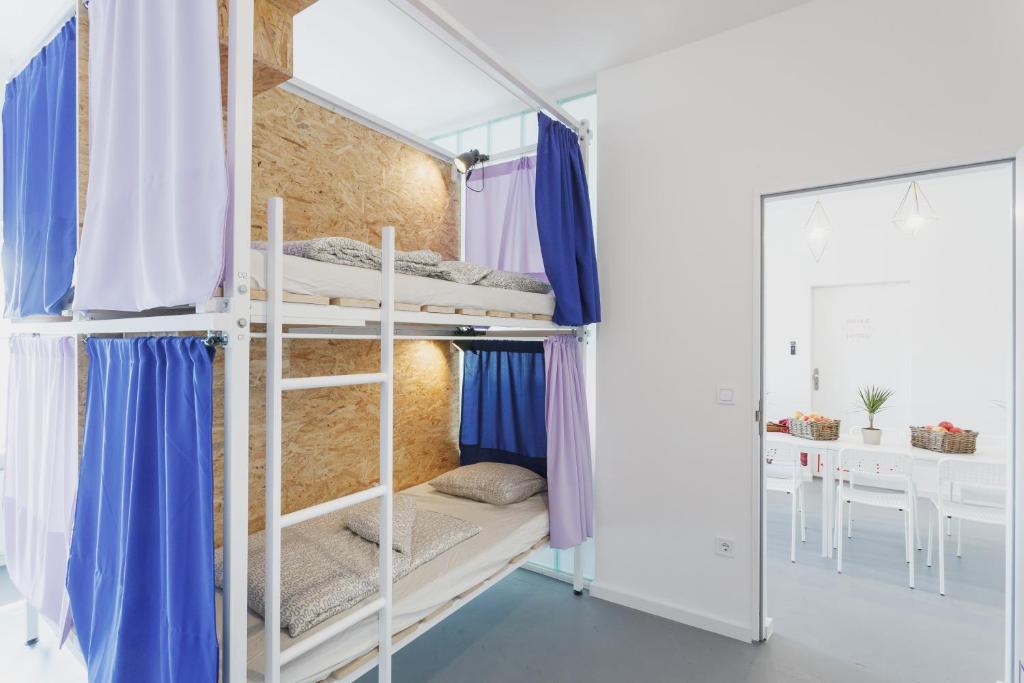 Postel nebo postele na pokoji v ubytování Avenue Hostel